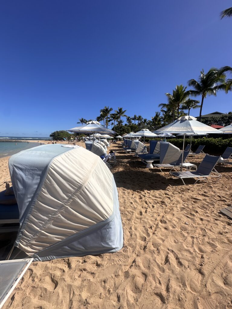 Review: The Ritz-Carlton O‘ahu, Turtle Bay — North Shore Luxury with Room to Breathe Hawaii Calling a beach with umbrellas and chairs