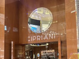 a restaurant with a sign on the wall